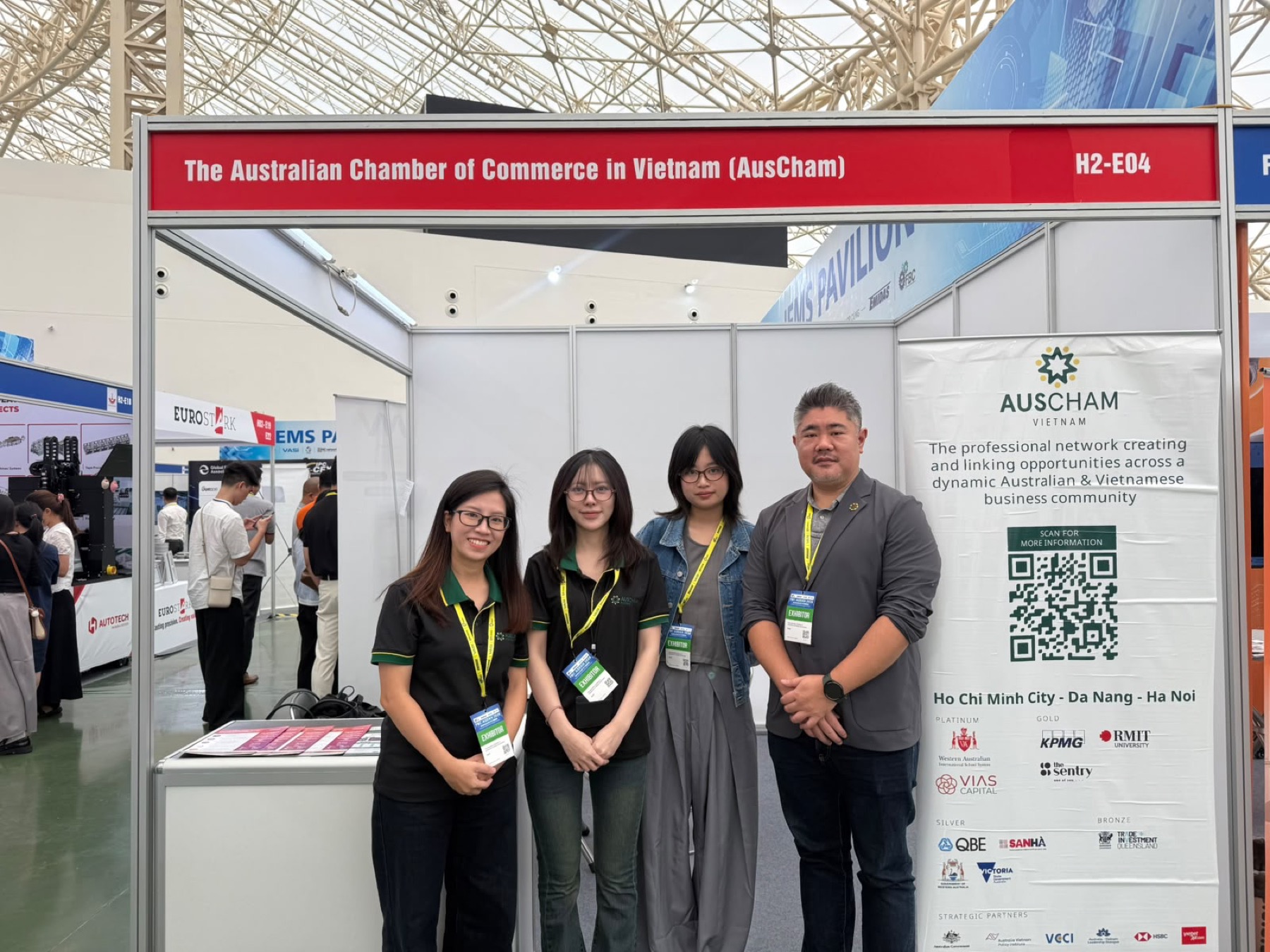 Four members of the AusCham team at the chamber’s exhibition stand